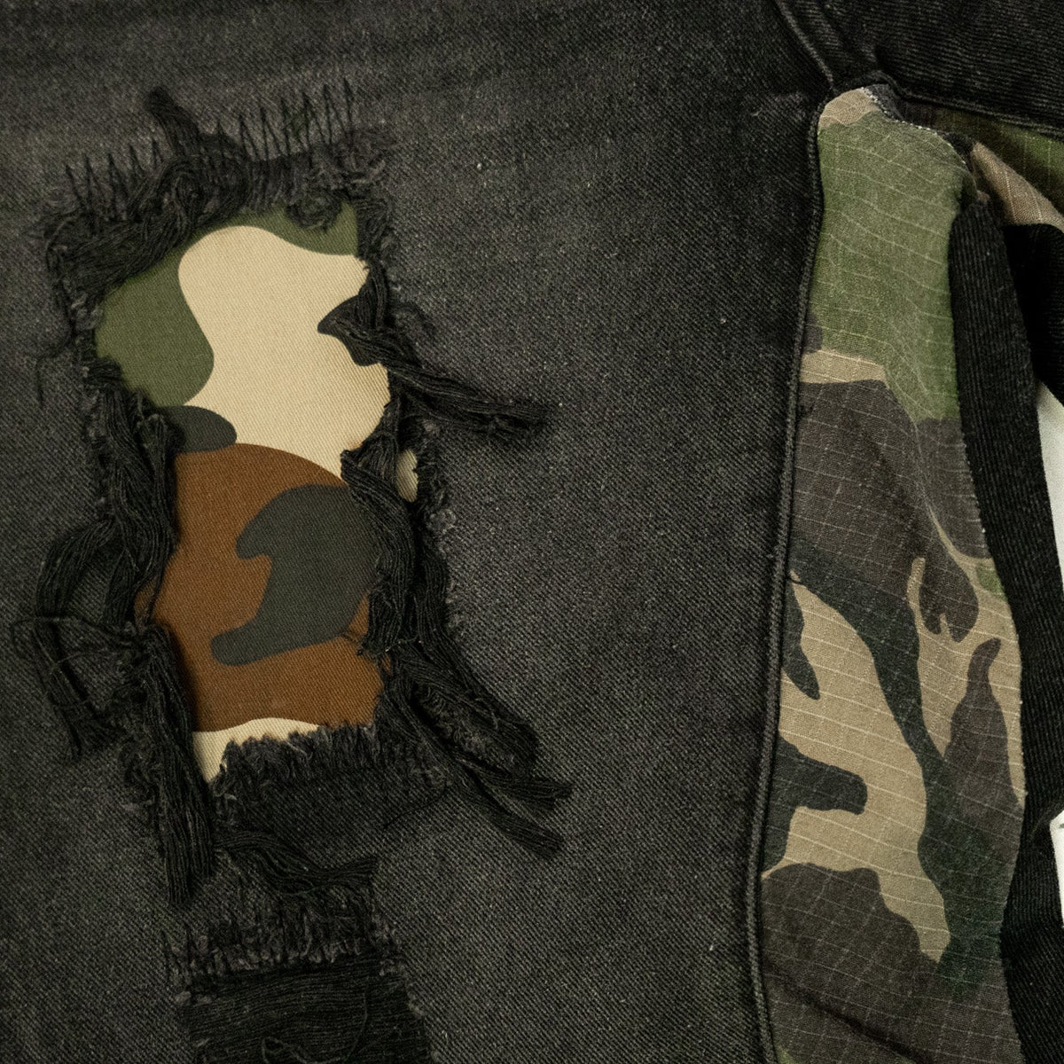 REBEL CAMO FLARE JEANS